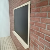 Black Board side on stone wall