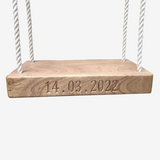 Wooden swing with engraving